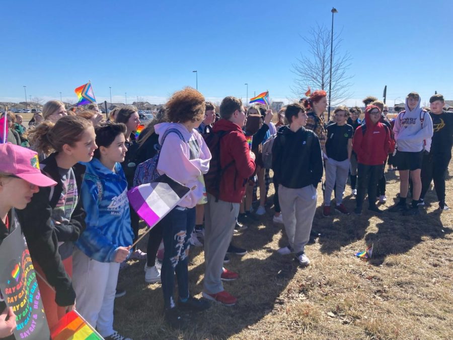 Ankeny students rally just outside of Ankeny High School holding pride flags and listening to speakers share personal stories about empowerment, frustrations, and hurt with regards to anti-LGBTQ legislation.  Ankeny High School students took part in a state-wide walkout along with 46 other schools and a total of 10,000 students on March 1. The walkout, organized by the Iowa Queer Student Alliance and Iowa WTF, was formed in response to recent legislation circulating the capitol. An estimated number of 150 students, grade 8-12, walked outside of the high school, waving rainbow flags and holding posters. 
