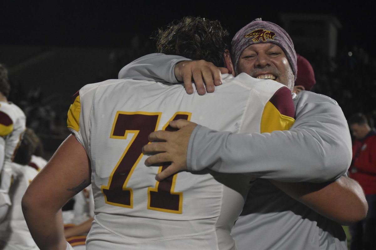 Lukis+Beroth+%2871%29+hugs+Coach+Jack+Ward+after+the+Ankeny+victory.