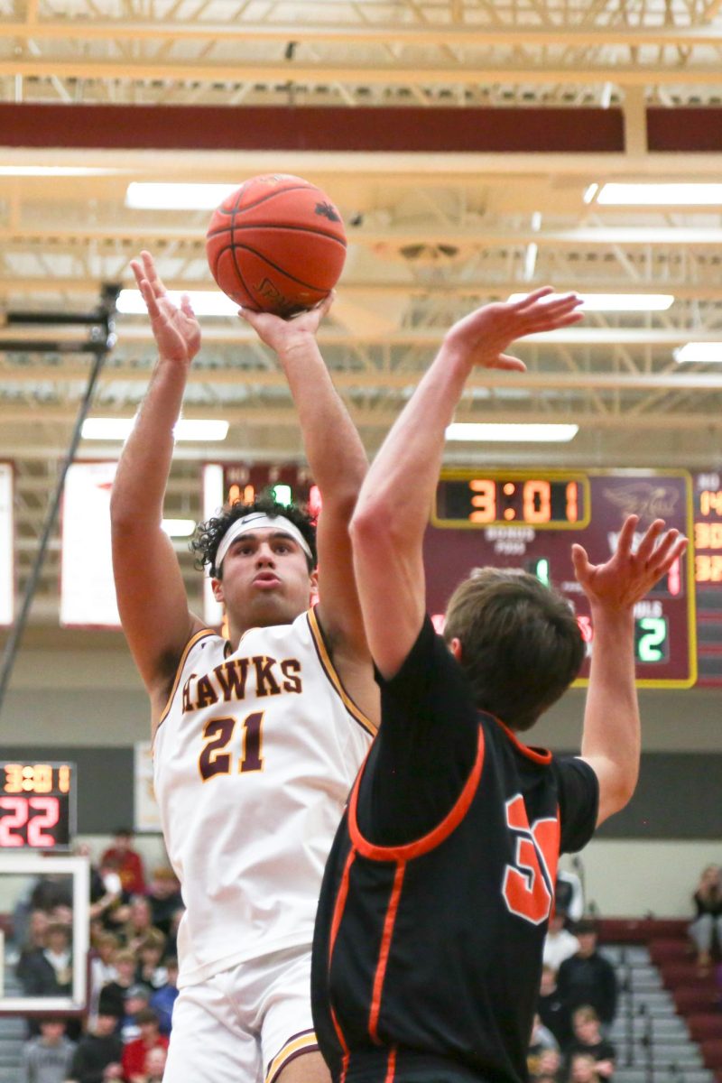 Senior Lio Aguirre goes up for a shot. Aguirre was the leading scorer for the Hawks, putting 16 points on the board for Ankeny.
