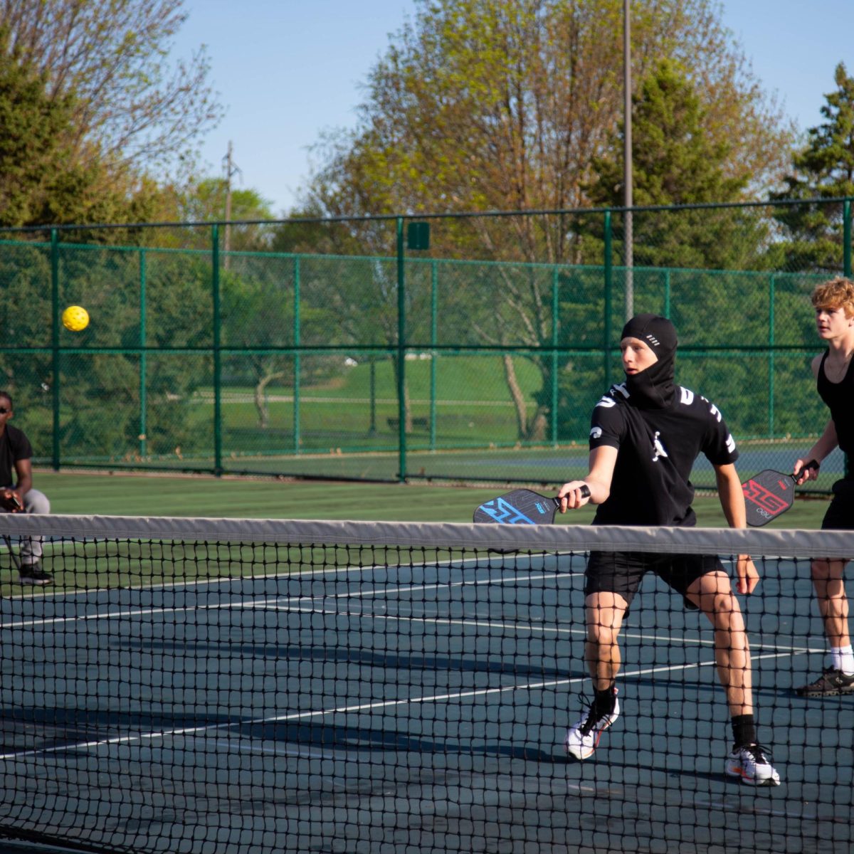 For many of the pickleball players, spending time with friends is just as much a part of the league as the game itself. The league is built to be flexible in working around players’ schedules. Because many of the players involved with the Ankeny Pickleball League are busy with other sports and activities, teams are open to finding any time to play, even if it means getting up early on a weekend for a game. 

On Sunday, May, the Houston Red Rockets and the Big Picklers went head-to-head in an early morning match-up. Sophomore Hayden Carlson hits the ball over the net.