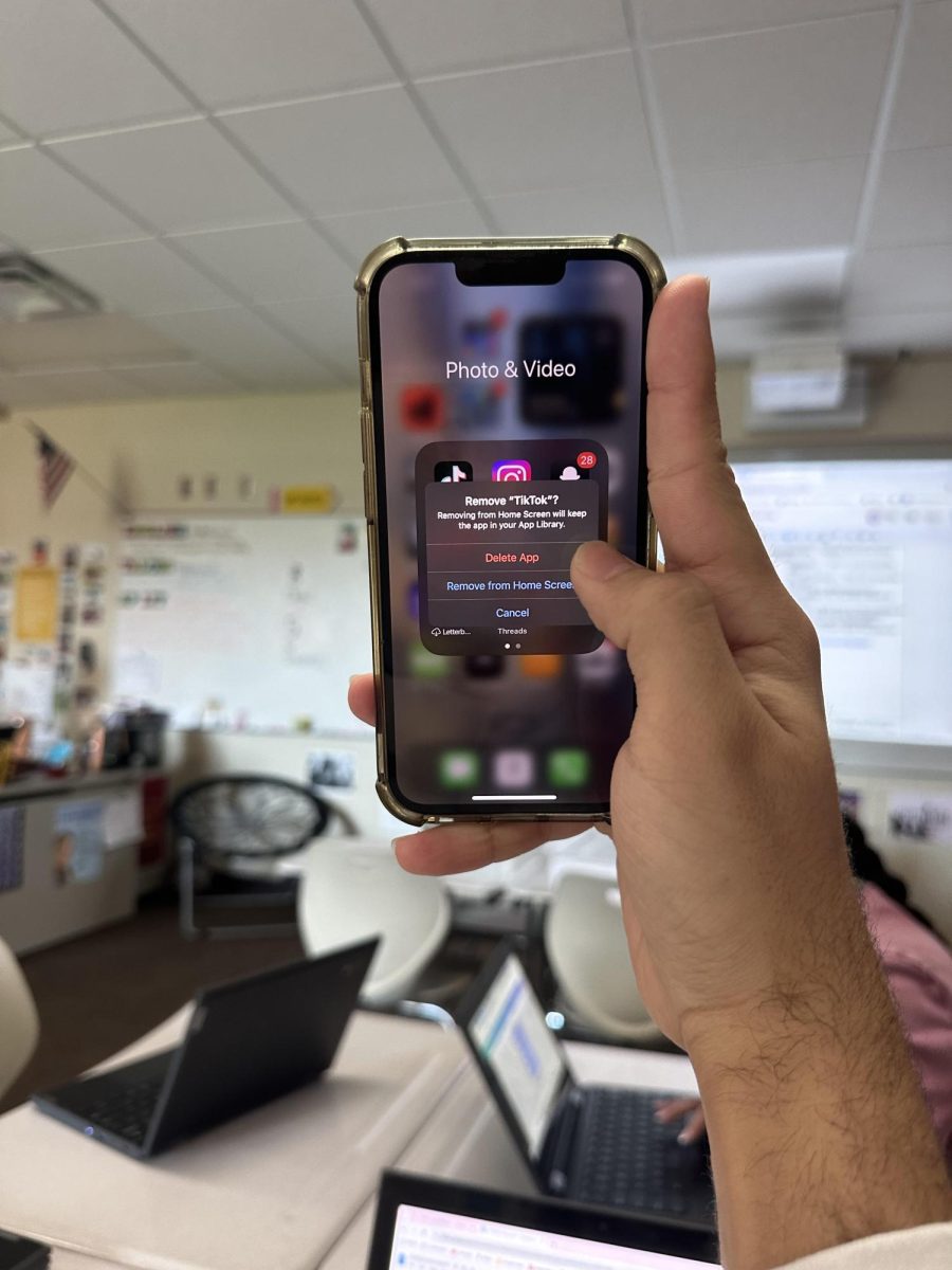 Senior Hunter Boswell deletes the app Tik Tok due to the recent news about the controversial, yet potential, Tik Tok ban in the U.S.
