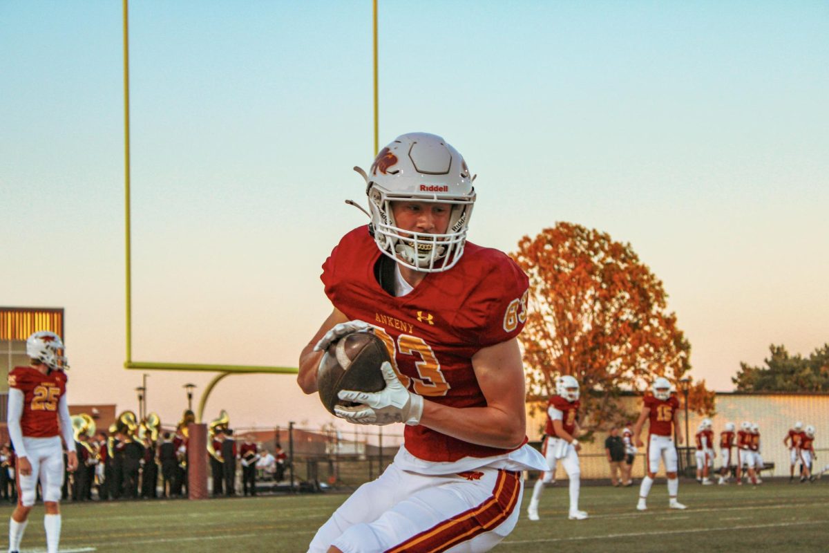 Junior Hayden Carlson warms up before the game.