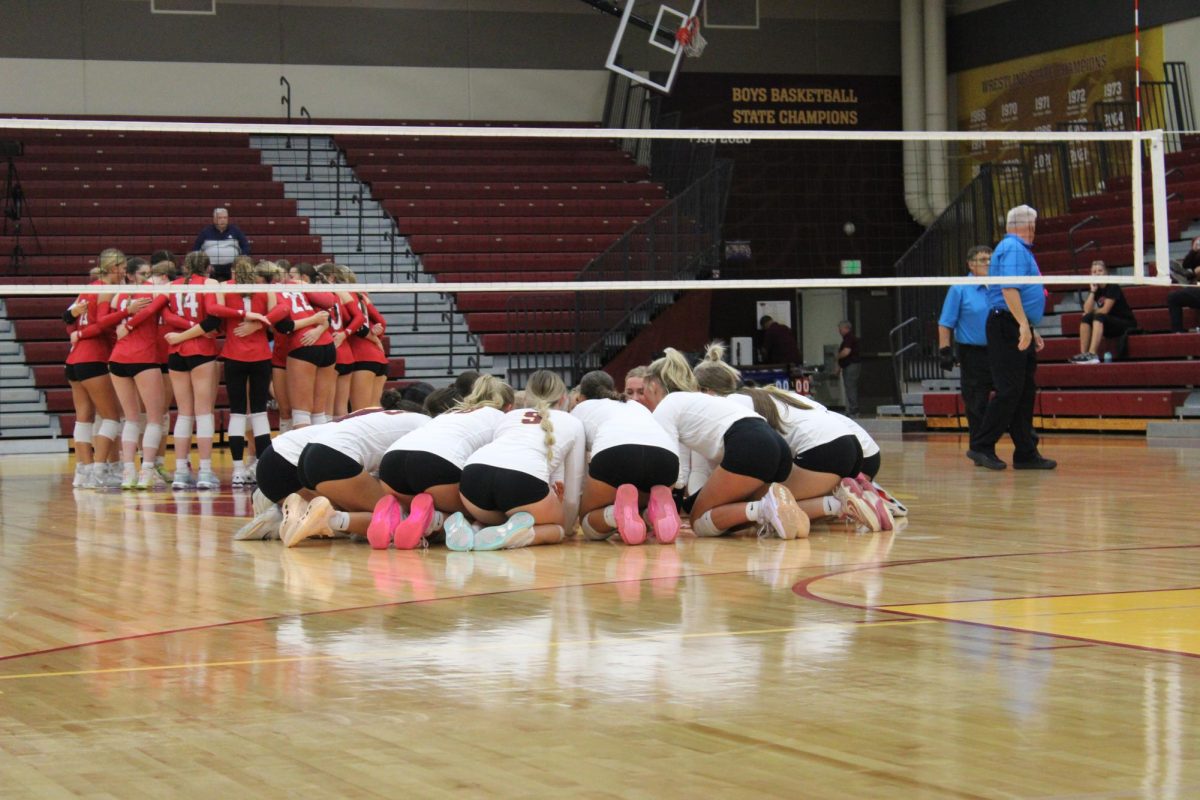 The Hawkettes get hype before the opening set. On Tuesday night, the Hawkettes faced off against Iowa City High and won with a set score of 3-0 to punch their ticket to Coralville against Waukee Northwest, which will take place on Monday, Nov. 4th. 