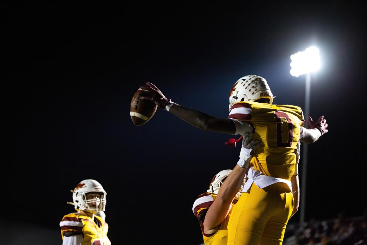 On Friday, November 1st, Ankeny took on the Linn-Mar Lions at home. Junior Daniel Larmie celebrates an Ankeny touchdown. 
