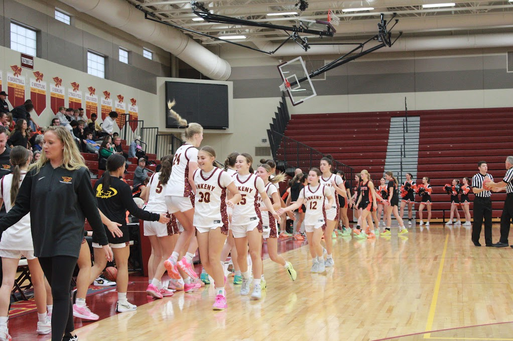 The Hawkettes celebrate after defeating the Ames Little Cyclones 66-28 on Saturday, Nov. 23.