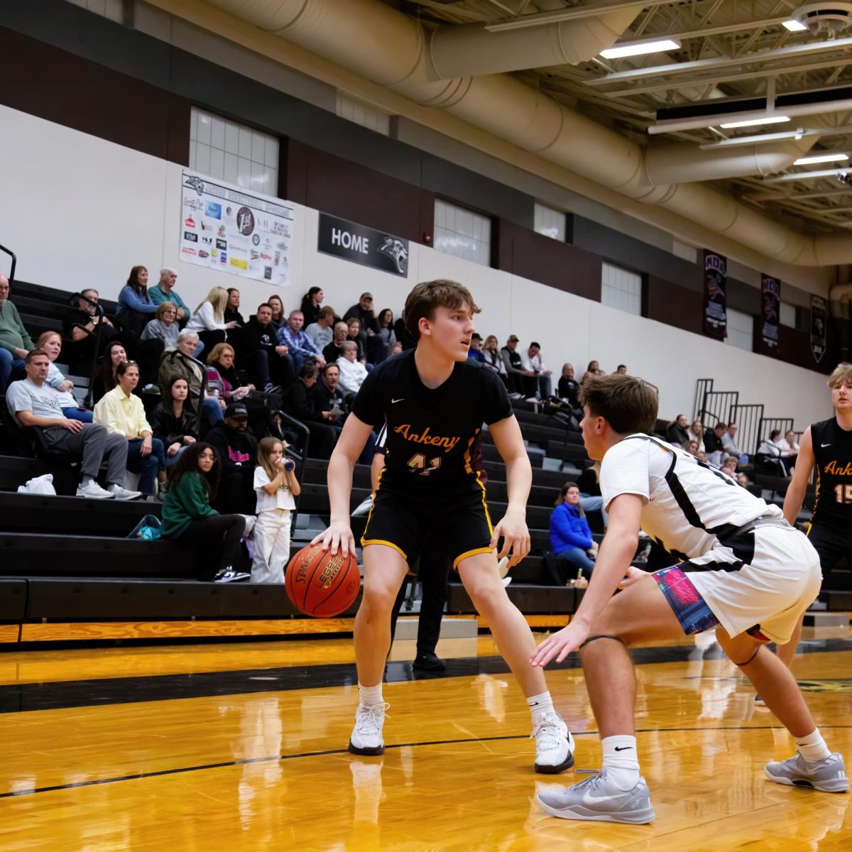 Junior Carson Bright protects the ball from a Centennial defender.