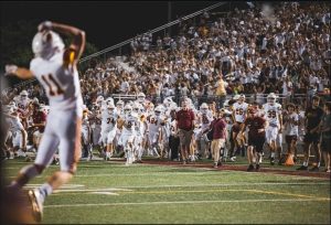 Varsity football celebration over big win against cross-town rival.
Photo published with permission by The Fittest Photographer 