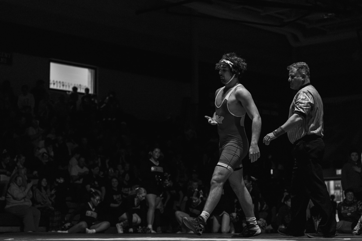 Ankeny High School senior Andrew Haase walks off of the mat after a win at the Ankeny versus Centennial dual meet on Dec. 12, 2024. Photo published with permission by Andrew Haase, Photo by Dylan Shoemaker, The Fittest Photographer