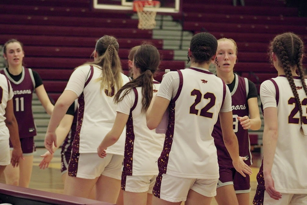 The Hawkettes shake hands after a 50-27 loss to the No. 2 Dowling Catholic Maroons.