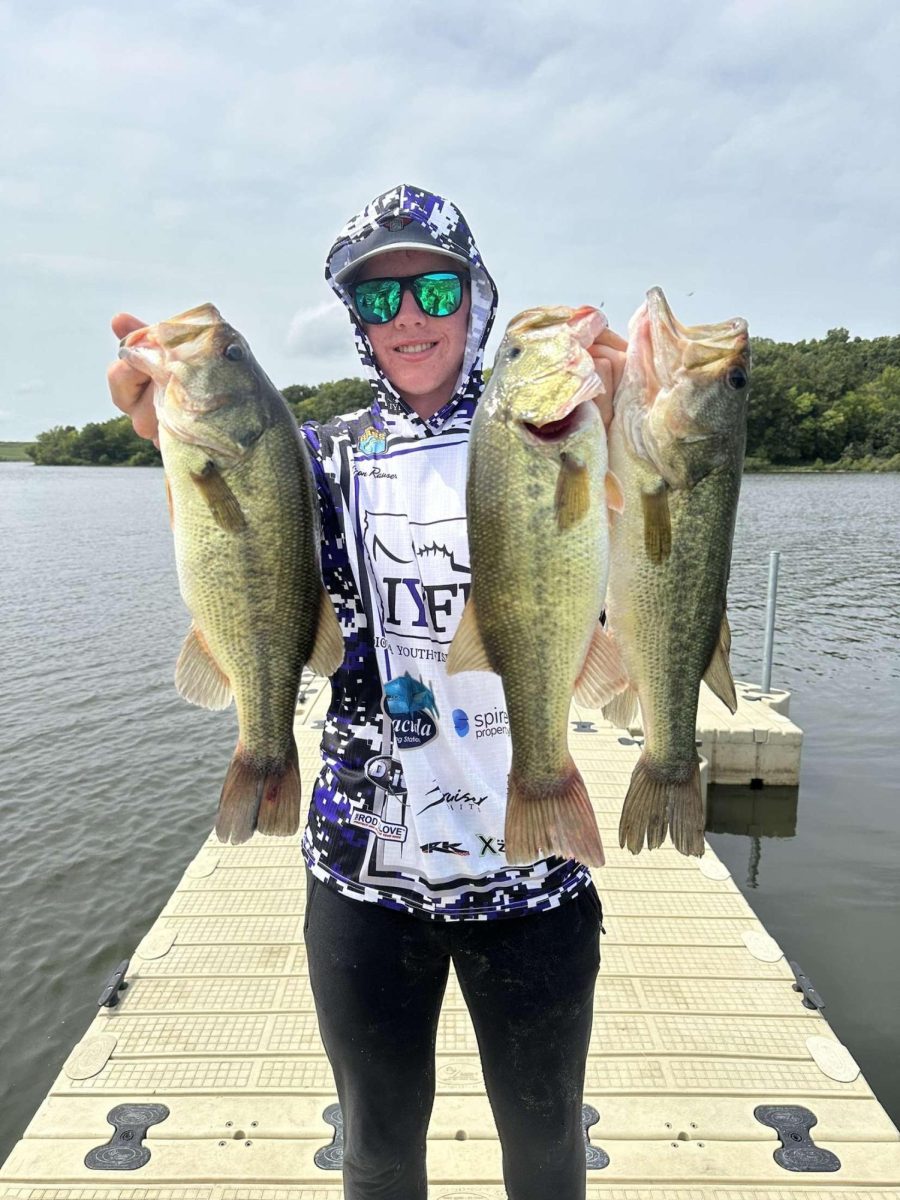 Ankeny High School senior Tyson Rauser holds three of his catches on Little River in Iowa. Photo permission by Tyson Rauser
