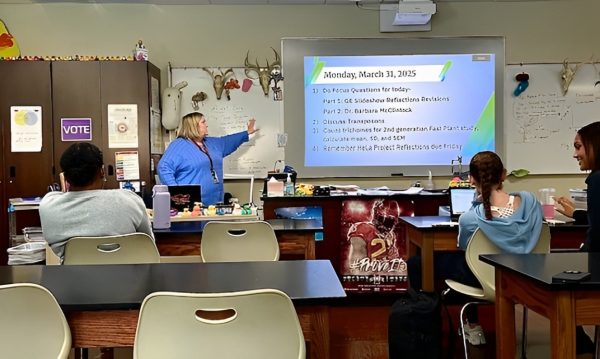 Bing talking about the plan for the day with her students in one of her AP Biology courses. “If I wasn't passionate about working with students, I don't think [I’d stay in teaching], but no, it's absolutely the students that I have that [make it worth it,” Bing stated. Photo taken by Sylvia Bartlett.
