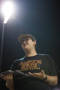 Senior Grady Andersen keeps stats at an Ankeny Hawks baseball game. He’s been helping with the team since his freshman year, and added roles in basketball and football by sophomore year. “Grady has found a place,” said his dad, Kiron Andersen. “And I hope he's created an opportunity for someone else.” That sense of opportunity and support runs through everything Grady does—from filming plays to mentoring underclassmen. Photo published with permission from Dylan Shoemaker (@thefittestphotographer)