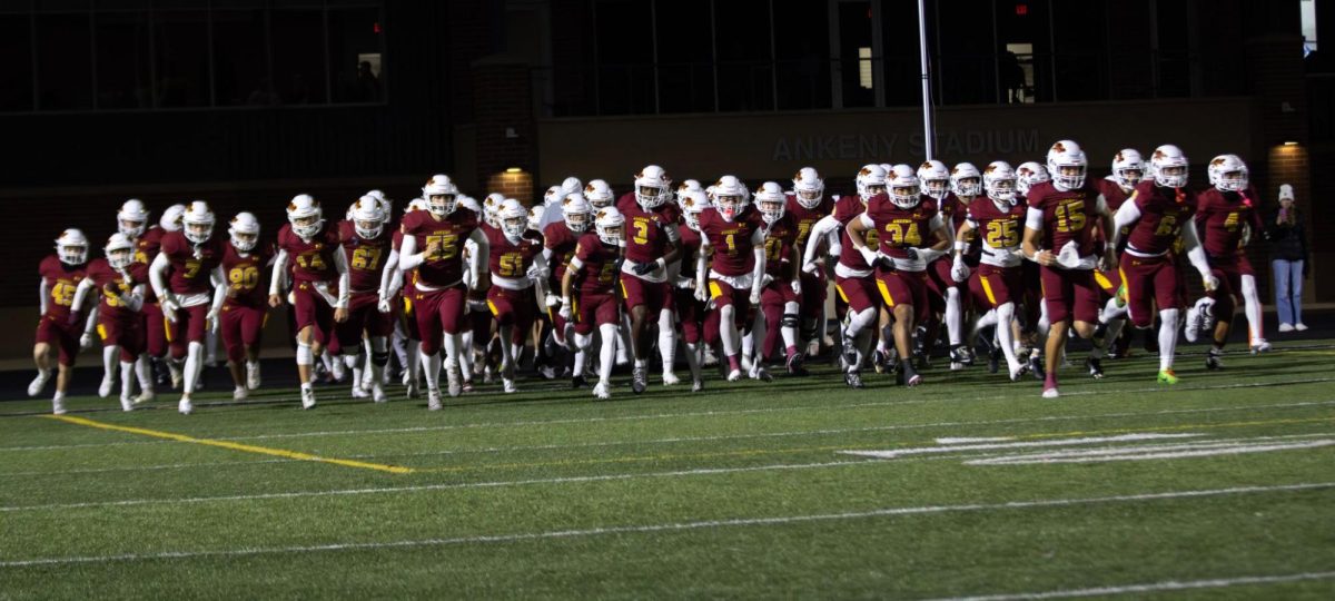 The Ankeny Hawks rush onto the field during their game on Friday, 10/31 Photo by Bryant Warren 
