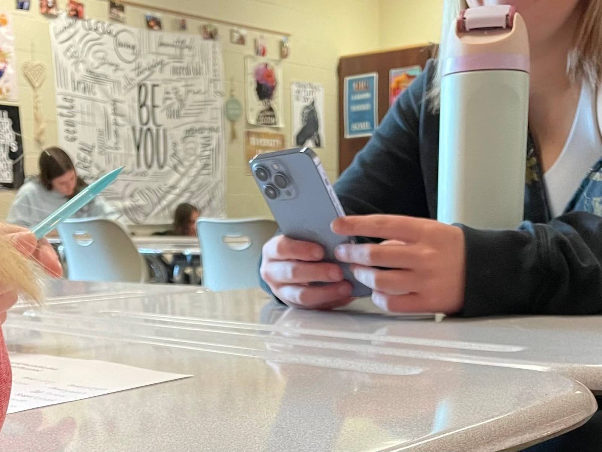 Surrounding peers are working on assignments and tests while a student checks her phone. “I never see referrals anymore. Last year it was a huge thing, but now it's died down a lot,” junior Zoyie Gatewood said.