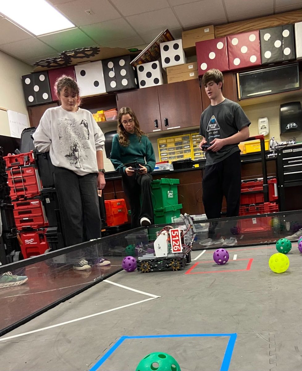 Members of team DICE practice controlling their robot, testing its functions and making sure it’s ready for competition. “You get to be a part of a great community. It's unlike anything I've ever done before, and I've found a love for it,” senior and robotics team lead Lucas Zea said.