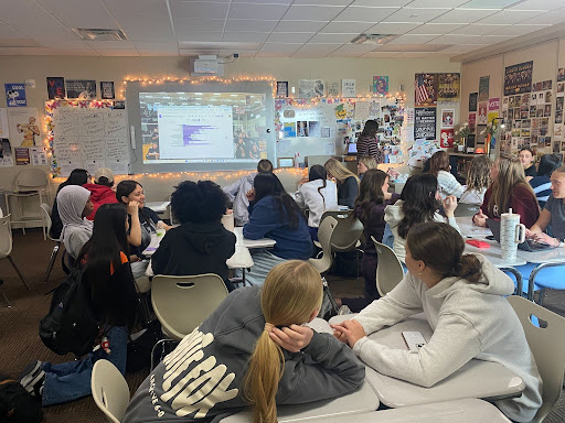 Members of the student council get together during Hawk Time to determine the Ankeny High School Prom dress-up days. The student council has a lot of influence on the themes and ideas for prom. English teacher, student council sponsor, and prom advisor, Emina Kovacevic, gets inspiration from student council.
“It’s just a wide open invitation if anyone has ideas,” Kovacevic said. Photo by Lillian Bell.