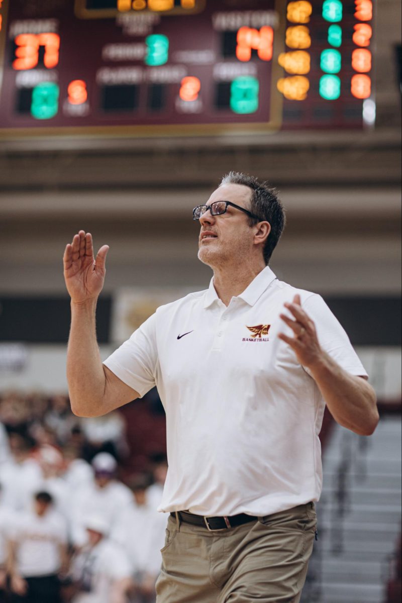 Head Coach Brandt Carlson Watches on during a game, photo used with permission from Dylan Shoemaker 