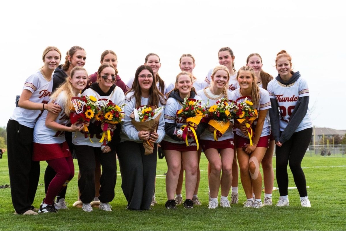 Ankeny Girls Thunder Lacrosse poses for a photo. 