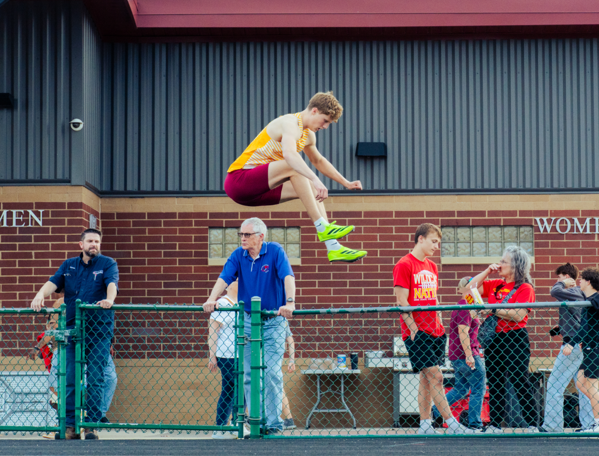 Senior Hayden Carlson prepares for his 4x200m race. Carlson, and seniors Finn McClure, Treyton Grossman, and Owen Fischer finished the race in 1st, running a time of 1:29.21. This puts them at #11 for the 2026 Iowa Outdoor High School Rankings. 
