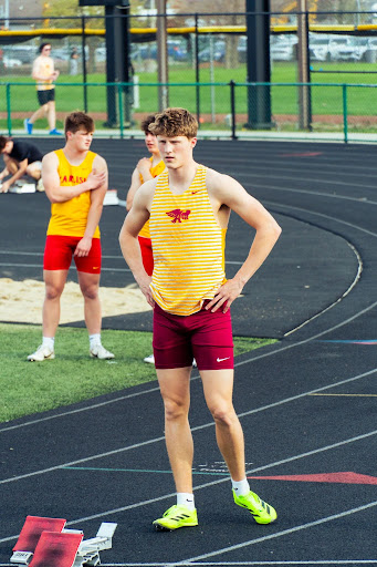 Carlson prepares before the start of the 4x200 relay at the Fred Smith Hawk Relays on 4/14. Photo by Suri Sithep.